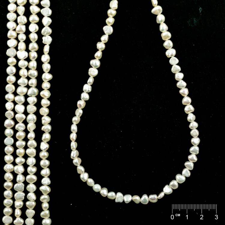 Rang Perles de culture d'eau douce baroque blanches